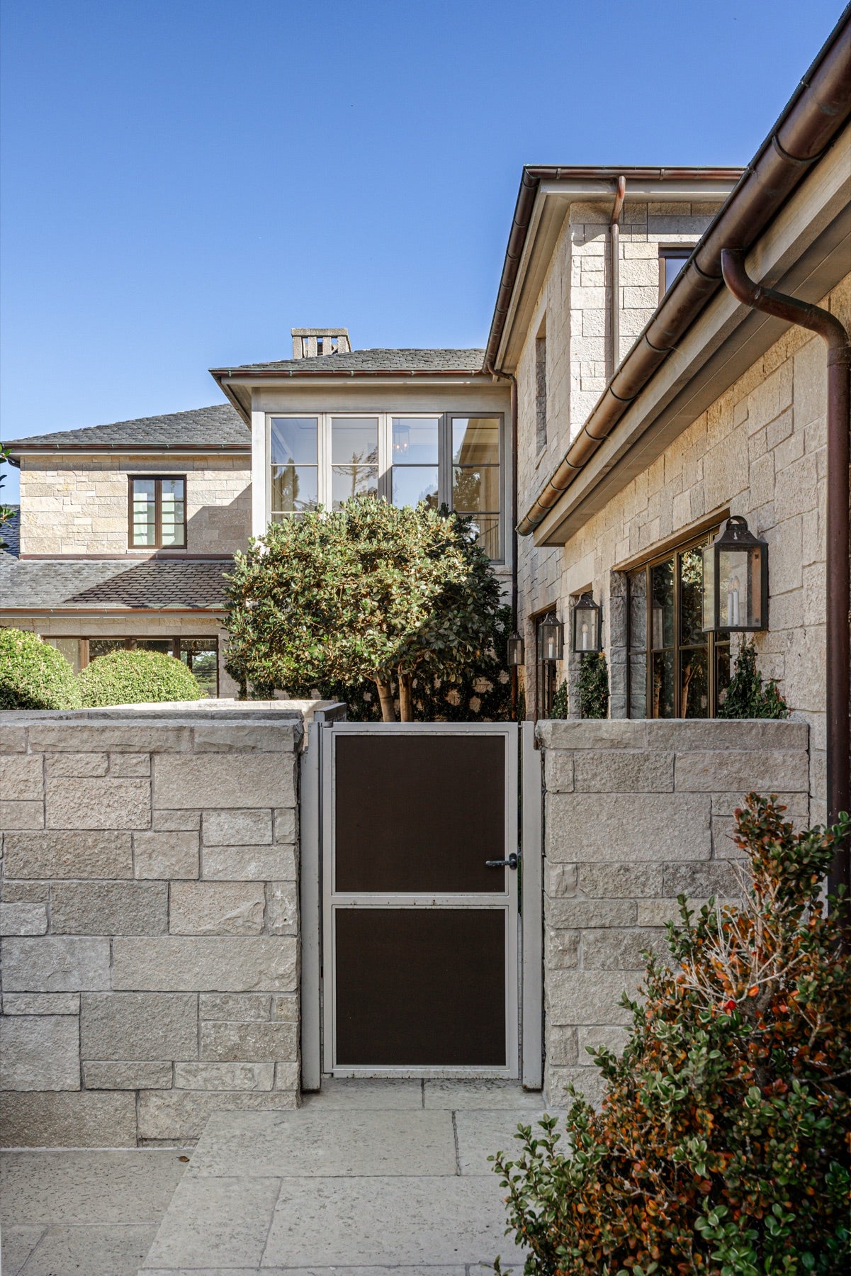 Stone courtyard wall and entry gate, Scenic Drive, Carmel